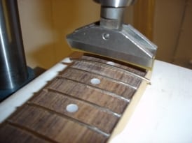 Guitar fret press